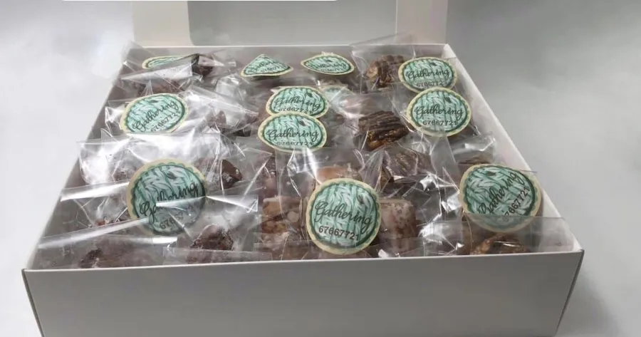 Box of mixed pecanized, sesame and coffee cake