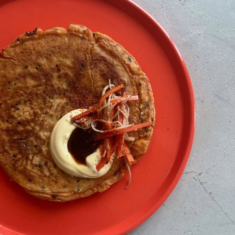 kimchi cheese pancake with pickled enoki and carrots