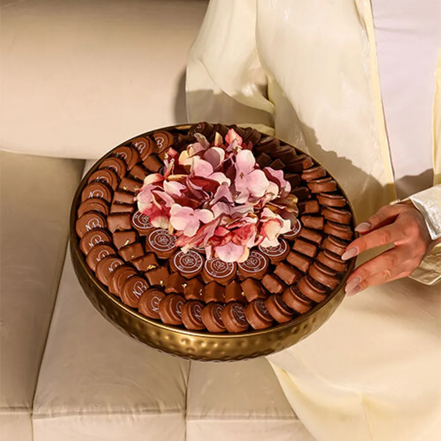 A tray of golden chocolates.