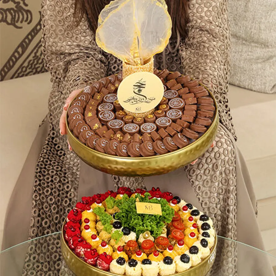A tray of chocolates with a mix of golden-colored MIX Fatayer (decoration)HAJJ