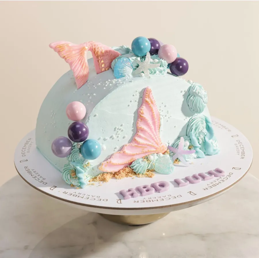 Mermaid round cake with blue frosting