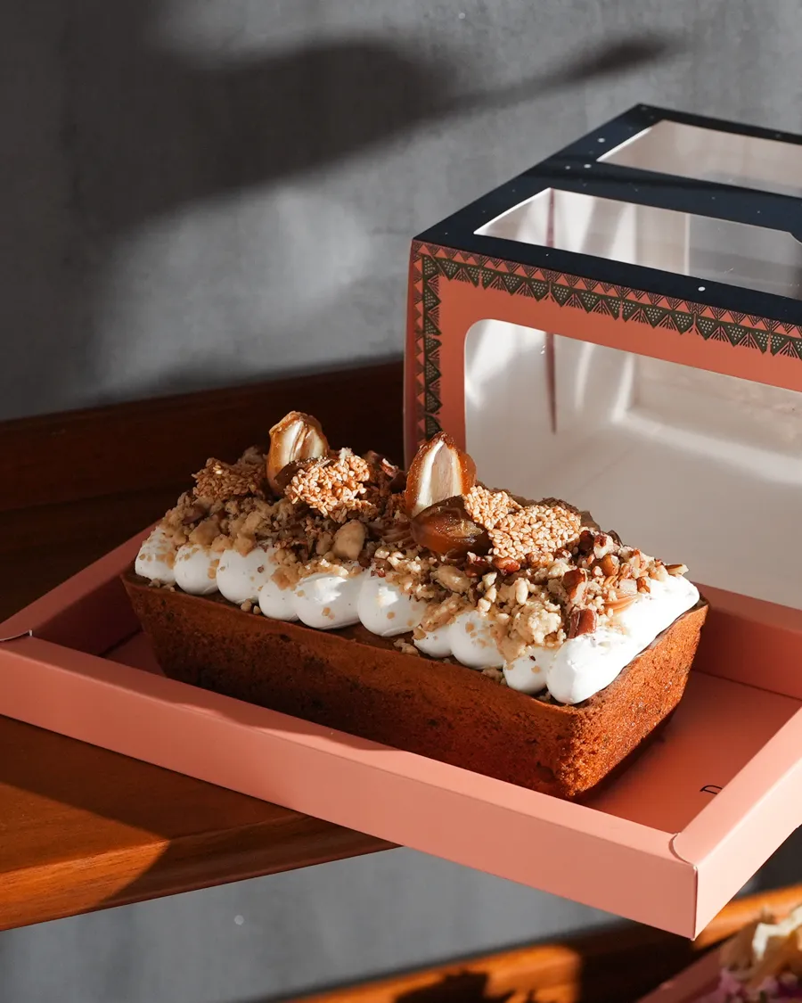 English cake with dates, nuts, and cream