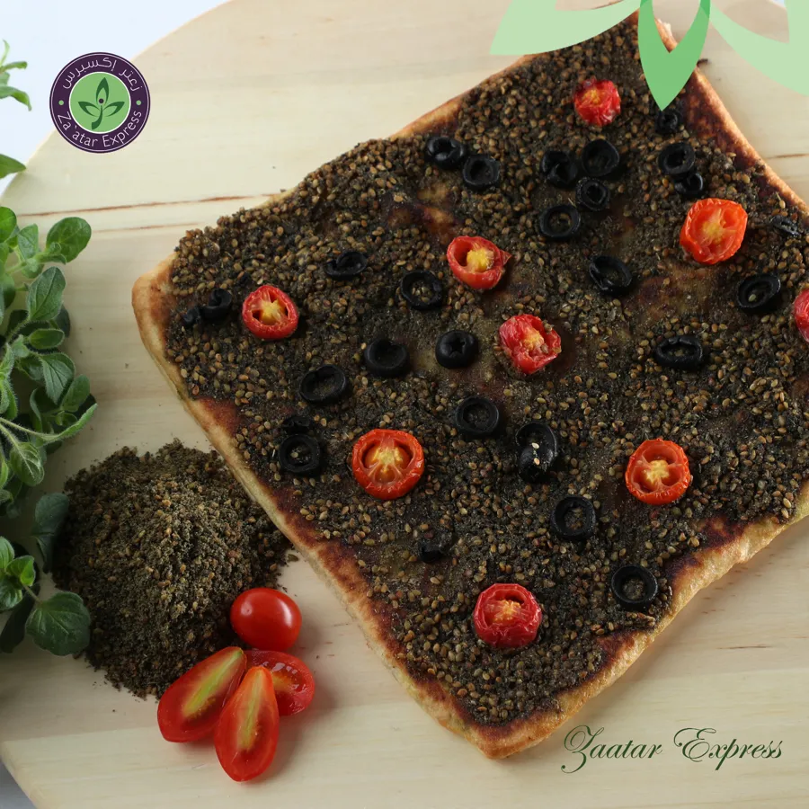 Zaatar, stuffed with Hallom ,topped with tomato .