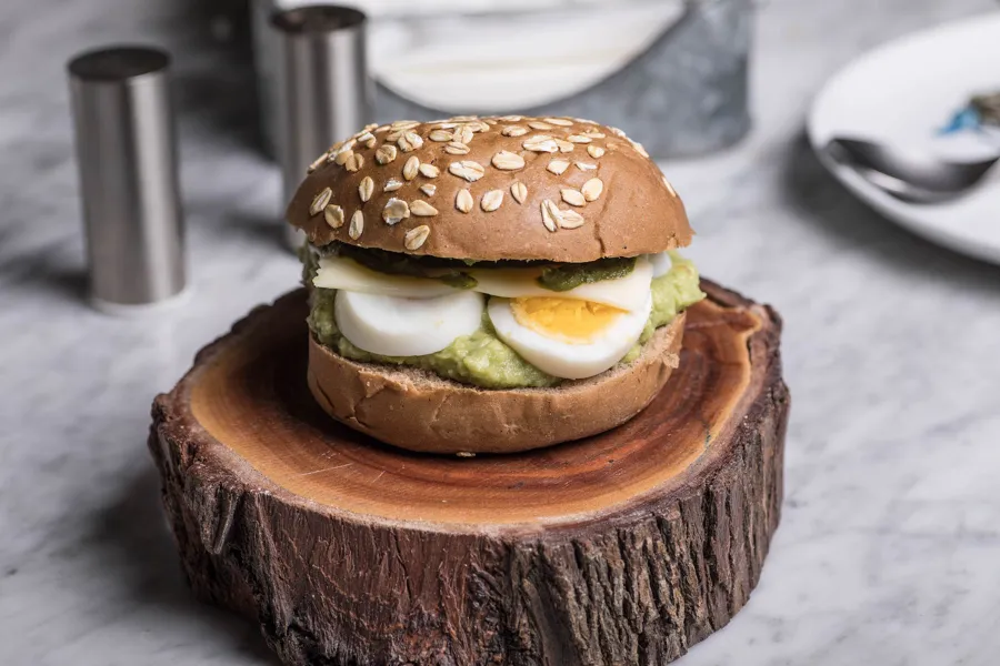 Sliced boiled egg guacamole sandwich