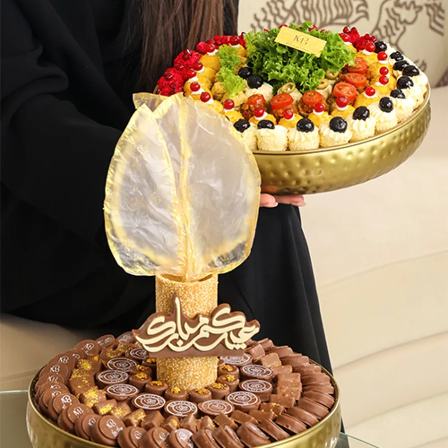 A tray of chocolates with a mix of golden-colored MIX Fatayer eid(decoration)